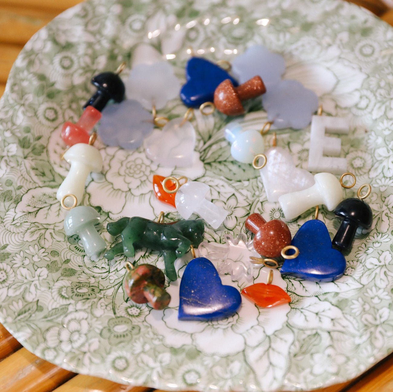 assorted stone charms on plate